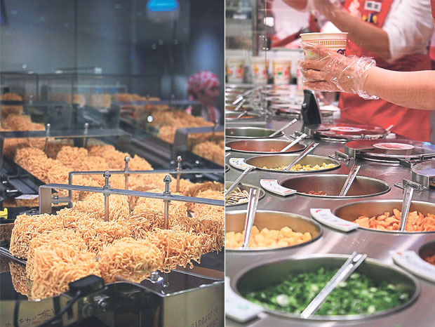 Instant noodles being fried in hot oil to remove its water content (left). Choose from various toppings and make your own customised cup noodles at the My Cup Noodles Factory! (right)