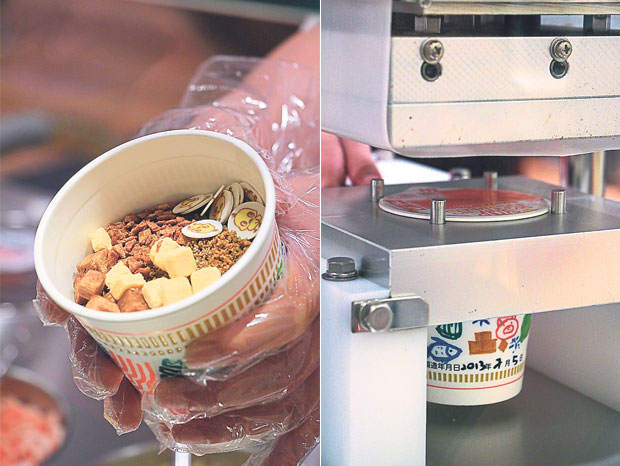 Mix-and-match and fill your cups — there is no flavour combination that’s too weird (left). A machine covers your customised cup with a signature Nissin cup noodles lid (right)
