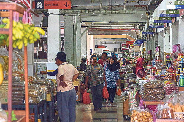 The middle section of the market is filled with shuttered shop lots that sell dry goods
