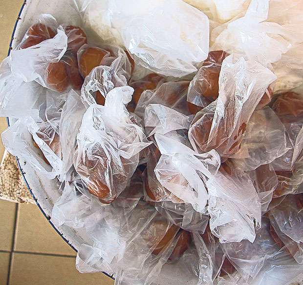 These dark brown legumes are called jering in Malay, and eaten raw, accompanied by freshly grated coconut