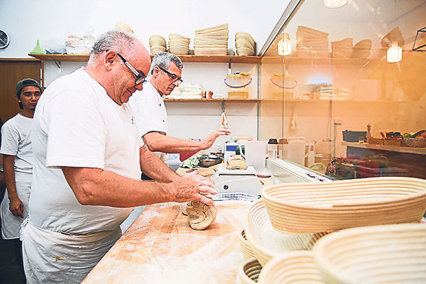 Klaus Adolph is so skilled in baking that he can knead two portions of dough at one time