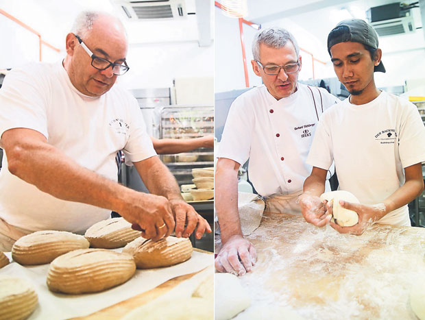 Klaus Adolph is Der Backmeister’s consultant baker with 50 years of experience (left). Ireks Gerhard Stichlberger, a supplier for Der Backmeister’s ingredients was at hand to teach their baker, Mohamad Shafik some new bread recipes (right)