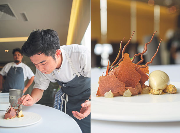 Adding the pisang goreng ice-cream, which is made from blended deep fried bananas to the smoked chocolate dessert (left). One of Dewakan’s desserts is the smoked chocolate with banana that combines smooth smoked chocolate chantilly cream with nutmeg syrup, sprigs of dill and a pisang goreng ice-cream (right)