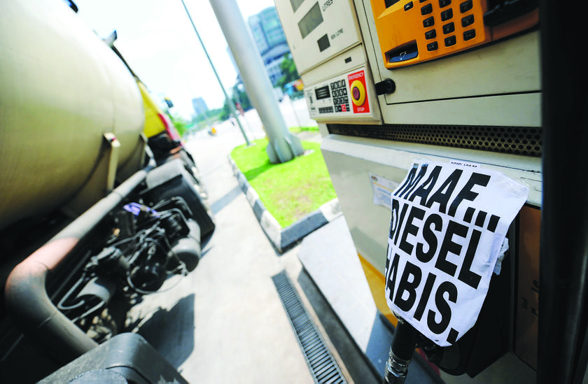 A temporary 'sorry, out of diesel' notice placed on the nozzle of a pump at a petrol station in Jalan Duta, Kuala Lumpur. u00e2u20acu201d Picture by Shahir Omar