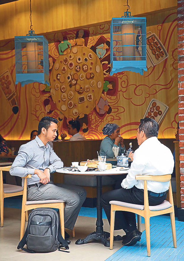 Dine under birdcages at Dolly Dim Sum.