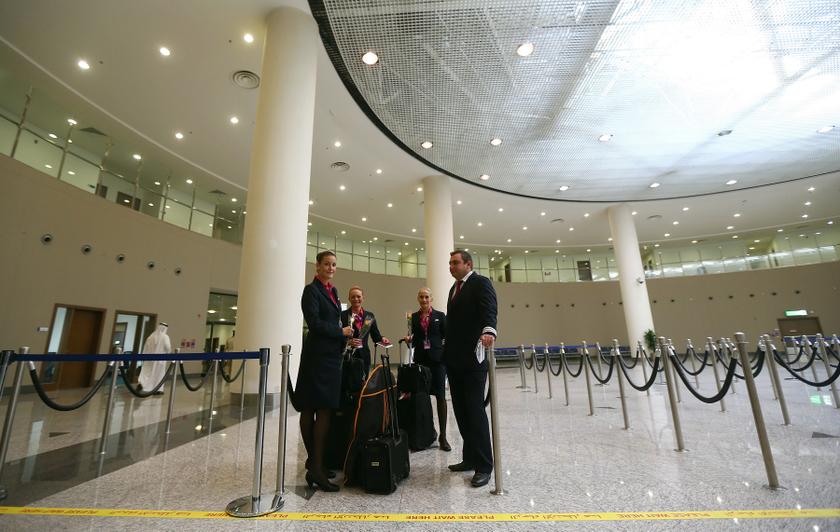 The crew of the low cost Hungarian Wizz Air wait their turn to have their passports stamped at the newly opened Al-Maktoum International airport, the emirate's second airport in Dubai, on October 27, 2013. The new passenger terminal opened its doors for b