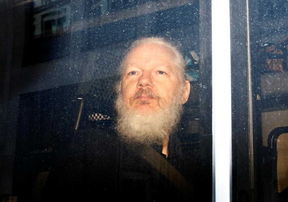 WikiLeaks founder Julian Assange is seen in a police van, after he was arrested by British police, in London, Britain April 11, 2019. u00e2u20acu201d Reuters pic 