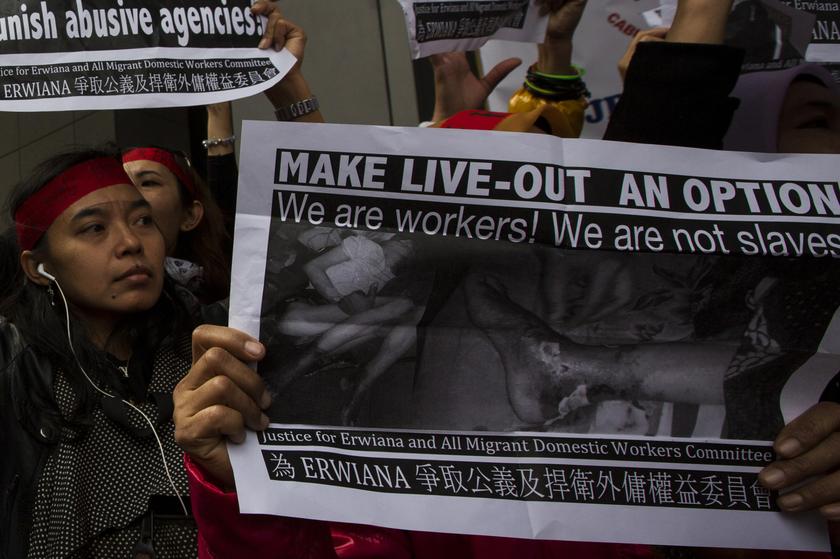 Domestic helpers and their supporters carry pictures of injured helper Erwiana Sulistyaningsih during a march to demand an investigation into her abuse, in Hong Kong January 19, 2014. u00e2u20acu201d Reuters pic