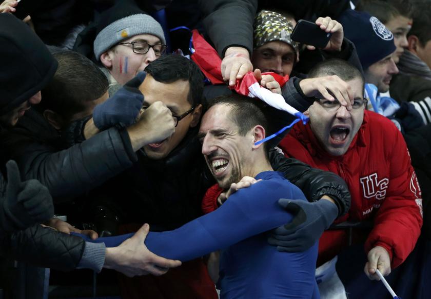 France's soccer team player Franck Ribery celebrates with supporters after winning their 2014 World Cup qualifying second leg playoff football match against Ukraine at the Stade de France in Saint-Denis near Paris November 19, 2013. u00e2u20acu201d Reuters pic