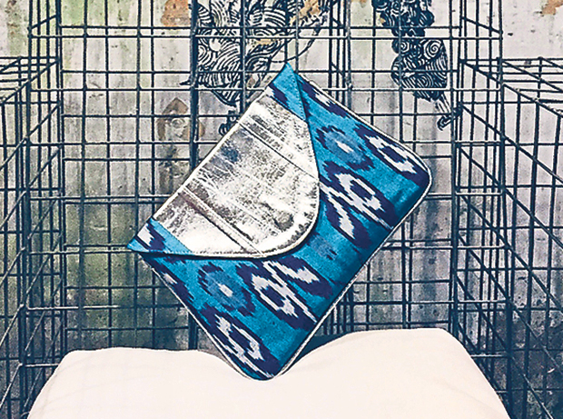 The J Ikat clutch features a leather flap for a touch of luxe
