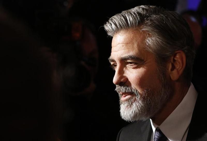 US actor George Clooney answers journalistsu00e2u20acu2122 questions on the red carpet ahead of the ceremony of the German Media Award. u00e2u20acu201d Reuters pic