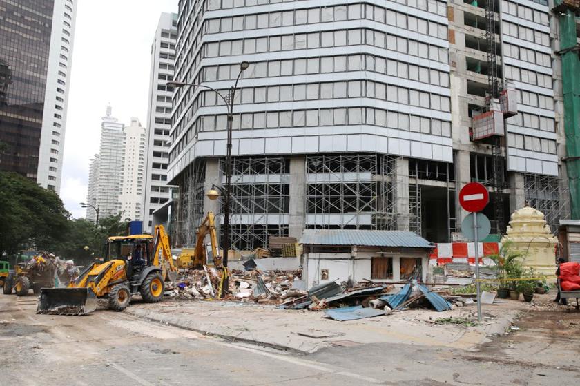 Debris and excavators are visible next to the shrine of the Golden Triangle Muneswarar Kuil in Kuala Lumpur, November 10, 2013. u00e2u20acu201d Picture by Choo Choy May