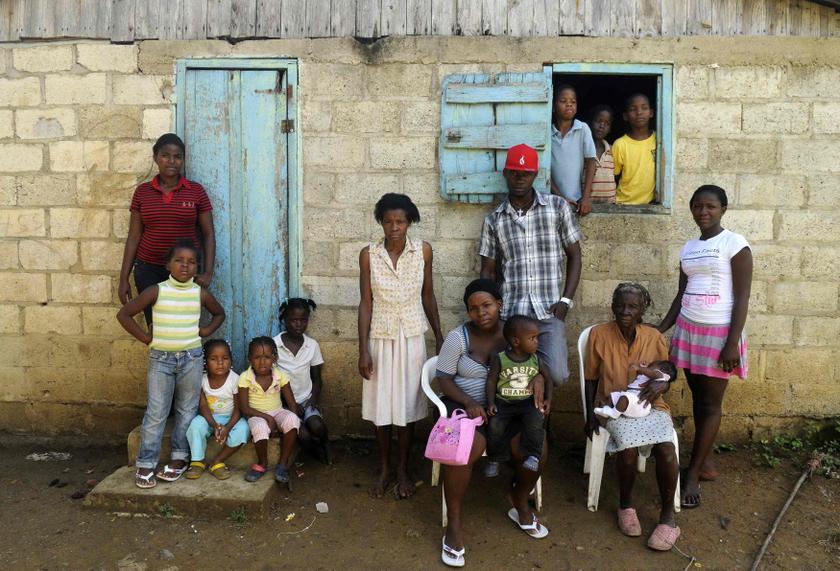 Sentilia Igsema (2nd right, seated), born in 1930 in the Dominican Republic to Haitian immigrants, poses with four generations of her family outside their home in Batey La Higuera, in the eastern Seibo province, October 7, 2013. u00e2u20acu201d Reuters pic