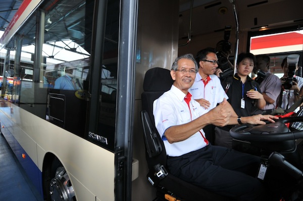 Syarikat Prasarana Negara Berhad (SPNB) group chairman Tan Sri Ismail Adam showing a thumbs up while seated in a new bus.