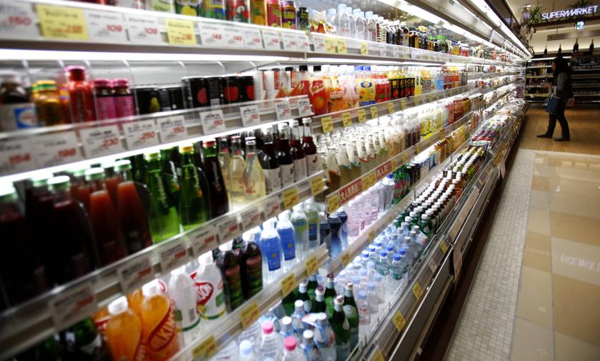 A woman looks at drinks at a supermarket at Ginza shopping district in Tokyo October 31, 2013. u00e2u20acu201d Reuters pic