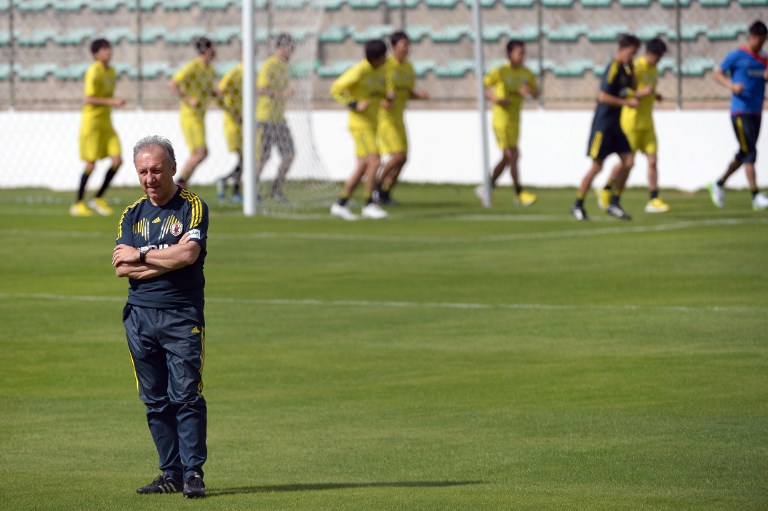 Japan's coach Italian Alberto Zaccheroni watches his players during a training session at Walmir Campelo Bezerra stadium in Gama, surburban Brasilia, Brazil, on June 16, 2013. 