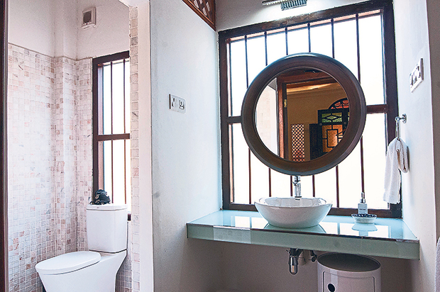 Attention is given to every detail of the room where wood lattice is apparent almost everywhere.