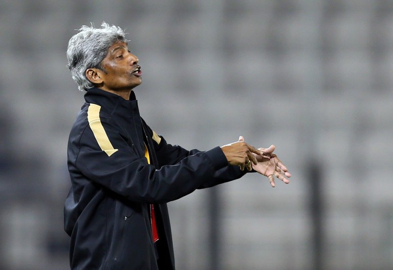 Datuk K Rajagobal gestures during his team's match against Qatar in the 2015 AFC Asian Cup group D qualifying football match in Doha, on February 6, 2013. u00e2u20acu201c AFP pic