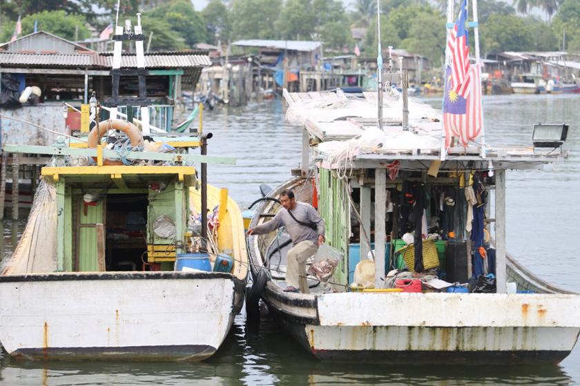 There are only about 100 boats at this fishing village in Kerteh. Many youths have gone to work in Petronas plants, leaving just the veterans in the fishing business, according to a fisherman. u00e2u20acu201d Picture by Choo Choy May