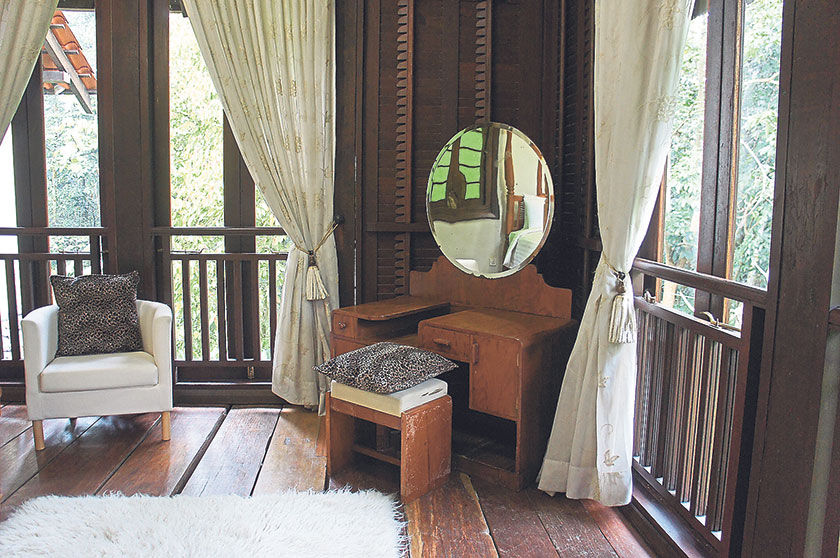 The antique dressing table is one of several vintage furniture pieces that the owner sourced from Malacca