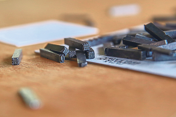Fallen pieces of lead types  consisting of Chinese characters, Roman characters and Tamil characters