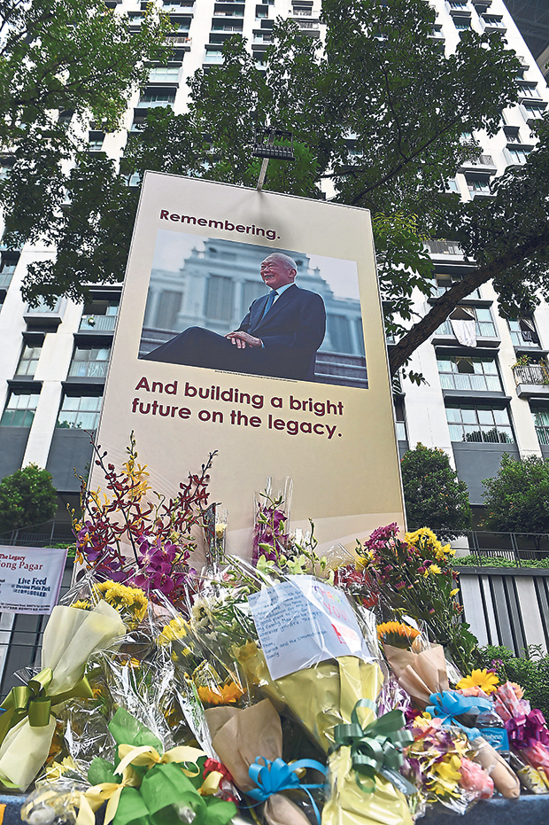 Flowers and messages to mark the first death anniversary of Singapore’s founding father Lee Kuan Yew on March 23, 2016. — Pictures from AFP