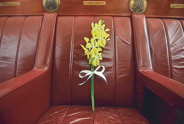 A bouquet of orchids seen on the parliamentary seat of founding father and former prime minister Lee Kuan Yew during a remembrance ceremony at the old Parliament