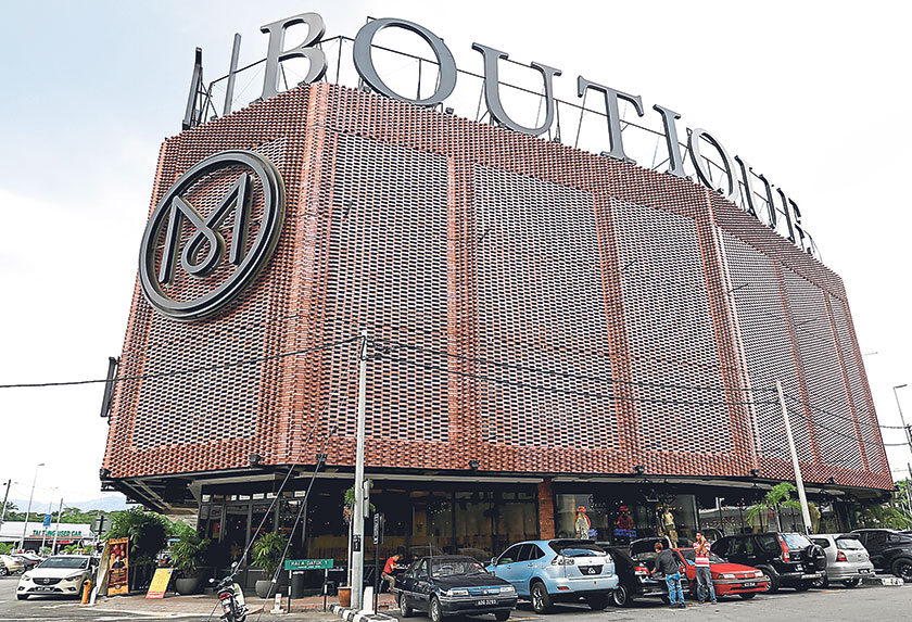 The hotel exterior with its woven brick façade and its giant signature ‘M’ logo