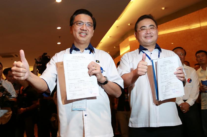 Datuk Seri Liow Tiong Lai and Datuk Wee Ka Siong arriving at the MCA building in Kuala Lumpur on December 16, 2013 for the MCA, Youth and Wanita nominations. u00e2u20acu201d Picture by Saw Siow Feng