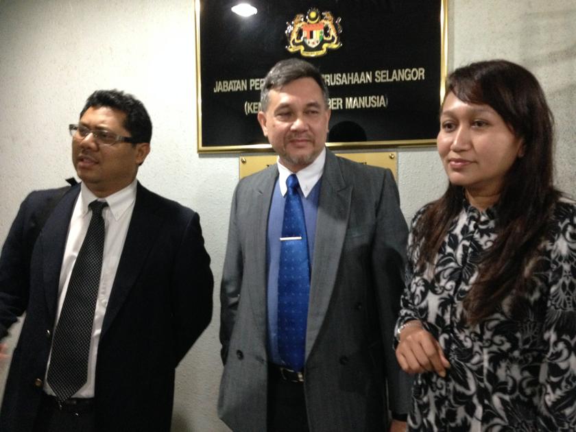 Sacked PKNS Holdings employers, Azlan Jamil, Dr Alif Aiman Abdullah and Rina Sarif speak to reporters outside the Department of Industrial Relations. u00e2u20acu201d Picture by Melissa Chi