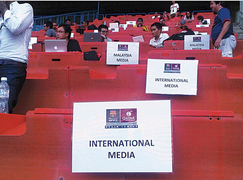 DOUBLE STANDARDS: Members of the international and local press were segregated at the media box during the Malaysia-FC Barcelona match on August 10, 2013. u00e2u20acu201d Picture by Haresh Deol