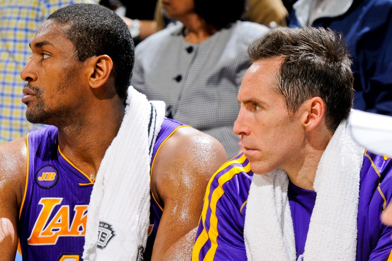 Metta World Peace #15 and Steve Nash #10 of the Los Angeles Lakers look on from the bench as the team plays the San Antonio Spurs in Game Two of the Western Conference Quarterfinals on April 24, 2013 in San Antonio, Texas. u00e2u20acu201c AFP pic