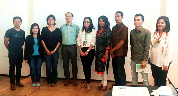 The team and participants behind the Migrant Worker Poetry Competition: co-organiser Shivaji Das (far left), second place winner Alika Nor Khalifa (second from left), head judge Bernice Chauly (fifth from left), and organiser Khairun Nisah Kamaruzaman (far right)
