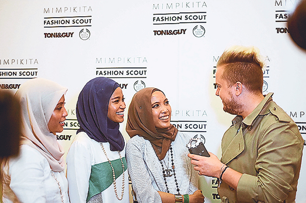 The sisters being interviewed at the London Fashion Week
