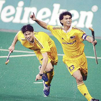 Malaysian skipper Mirnawan is ecstatic after scoring his team's third goal off the late Chua Boon Huat's (left) pass against India in the 2009 World Cup in Kuala Lumpur. Malaysia won 3-2.