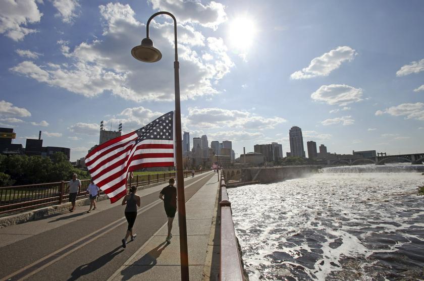 Runners cross the pedestrian-only stone arch bridge that crosses the Mississippi River downstream of the St. Anthony Falls (right) in Minneapolis, Minnesota July 3, 2013. u00e2u20acu201d Reuters pix
