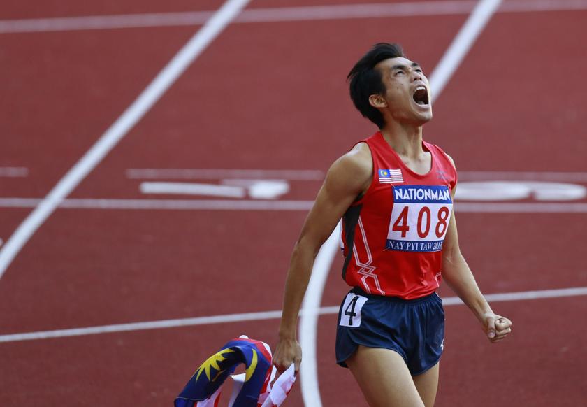 Mohd Jironi Riduan of Malaysia shouts after winning gold at the menu00e2u20acu2122s 800m final during the 27th SEA Games in Naypyitaw December 17, 2013. u00e2u20acu201d Reuters pic