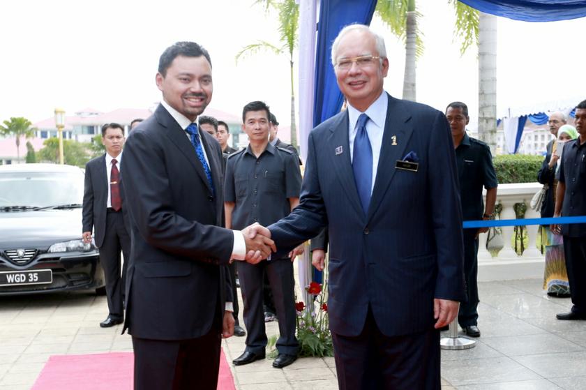 Prime Minister Datuk Seri Najib Razak greets Bruneiu00e2u20acu2122s Crown Prince DTYM Paduka Seri Pengiran Muda Mahkota Pengiran Muda Hali Al-Muhtadee Billah as he begins his official visit of Malaysia in Putrajaya November 12, 2013. u00e2u20acu201d Photo by Saw Siow Feng