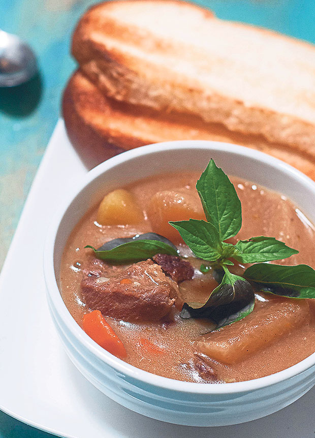 Lamb stew served with toasted roti benggali