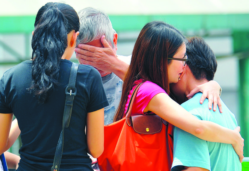 Pik Wan (right) being consoled by Yee Lian while William Sim tries to hold back his tears. u00e2u20acu201d Pic: Zuraneeza Zulkifli