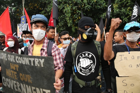 Twenty-five people were arrested for protesting in front of the parliament building on June 24, 2013. u00e2u20acu201c Photo by Choo Choy May