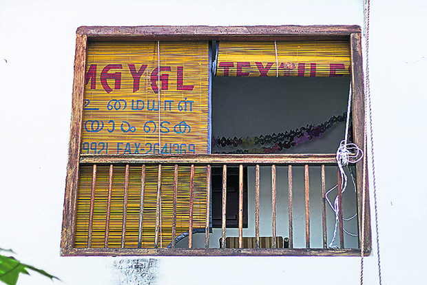 Block out the sun with these repurposed shophouse blinds