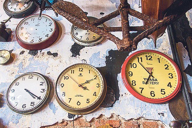 A wall of clocks at Junk Cafe