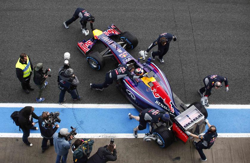 Red Bull Formula One driver Sebastian Vettel of Germany sits inside his RB10 as team members push his car into the garage during pre-season testing at the Jerez racetrack in southern Spain January 29, 2014. u00e2u20acu201d Reuters pic