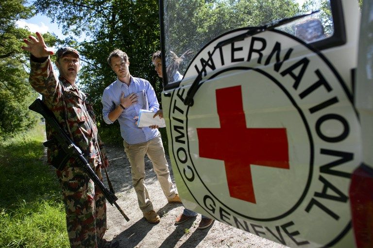 New delegates of the International Committee of the Red Cross (ICRC) argue with a staff acting a soldier during a simulation exercise in Versoix near Geneva. u00e2u20acu201d AFP pic