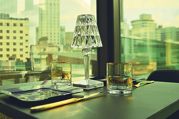 Kartell LED lamps decorate the tables, which can seat less than 30 people altogether