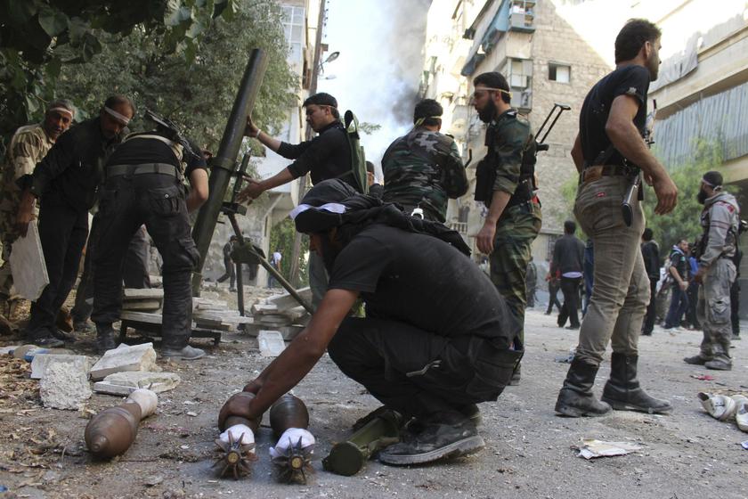 Free Syrian Army fighters prepare their weapons during an offensive against forces loyal to Syria's President Bashar al-Assad in Aleppo's Salaheddine neighbourhood, October 9, 2013. u00e2u20acu201d Reuters pic