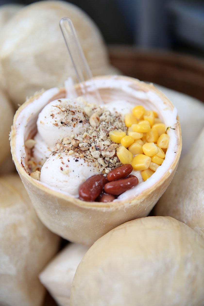 Their signature pairs 4 scoops of coconut ice-cream on a fresh coconut husk with flesh, a sprinkle of toasted coconut flakes and a choice of toppings like corn, toasted peanuts and red beans.
