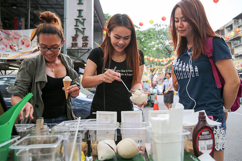 Customers from all over the world stop by for the refreshing coconut ice-cream on a cone or cup.