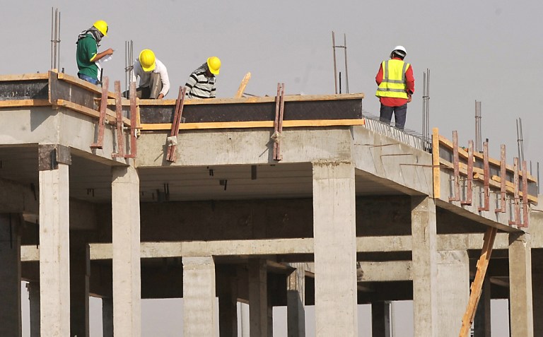 Foreign laborers work at a construction site in the Saudi capital Riyadh on October 30, 2013. Oil-rich Saudi Arabia, a magnet for mostly poor Asian foreign workers, has seen nearly a million of illegal workers quit, taking advantage of a six-month amnesty